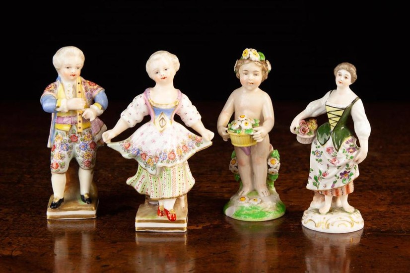 Four Small Continental Porcelain Figures. A pair of children in elaborate costume; the girl dancing