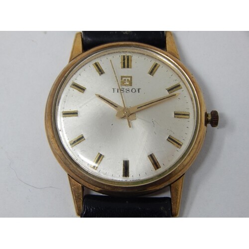 Gent's 9ct Gold Tissot wristwatch with a leather strap