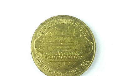 Gold-plated copper medal.
