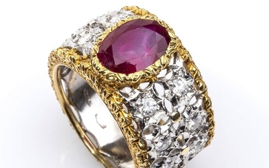Gold, ruby and diamonds ring 18k white and yellow gold openwork. Oval facetated cut ruby...
