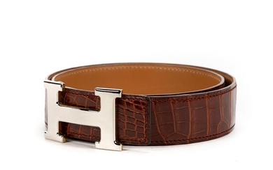 NOT SOLD. Hermès: A belt made of brown crocodileskin silver toned H buckle. Size 70. – Bruun Rasmussen Auctioneers of Fine Art