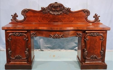 Large English rococo sideboard with carving