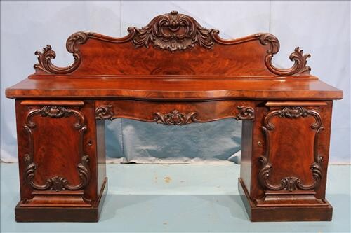Large English rococo sideboard with carving