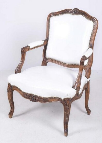 Louis XV style carved walnut open armchair