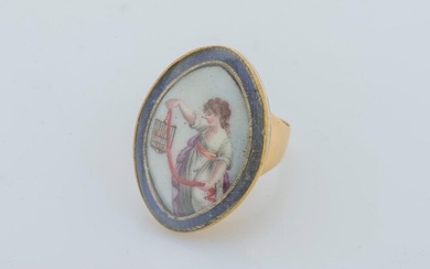 Marquise ring in 18 karat yellow gold (750 thousandths) set with a miniature of a young man with a painted birdcage, in a blue enamelled frame.