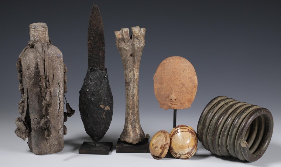 Namibia, Ovampo, two ivory and seven conus shell ornaments, ekipa; an Akan terracotta funerary head;...