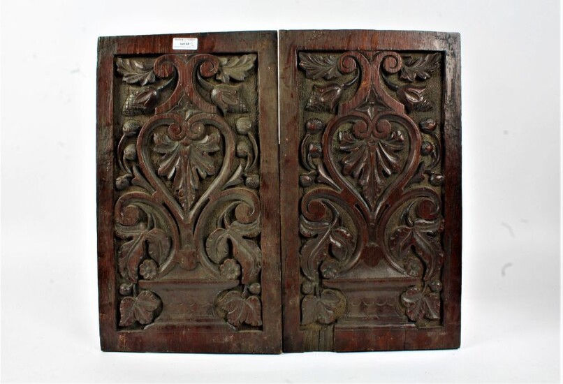 Pair of 19th century carved oak panels, carved in relief with leaves and scrolls, 46cm high x 26cm