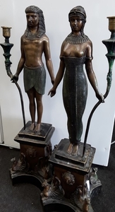 Pair of cold painted Egyptian candle holders. 65cm tall.