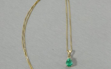 Pendant in yellow gold set with an emerald...
