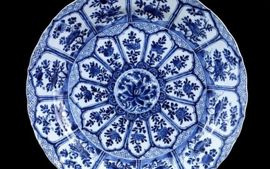 Porcelain dish with contoured edge and blue and white