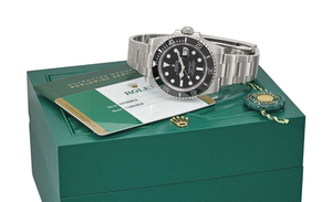 ROLEX. A STAINLESS STEEL AUTOMATIC WRISTWATCH WITH DATE, SWEEP CENTRE SECONDS, BRACELET, ORIGINAL GUARANTEE AND BOX, SIGNED ROLEX, OYSTER PERPETUAL DATE, SUBMARINER, 1000FT = 300M, REF. 116610LN, CASE NO. OZY85815, CIRCA 2016