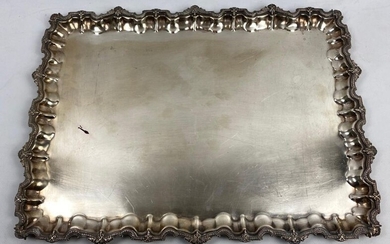 Rectangular silver platter with scalloped rim decorated with shells and foliage