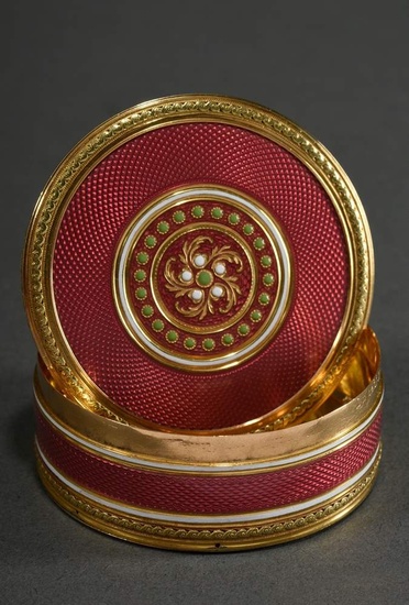 Round Louis XVI gold bonbonniere with strawberry rosé guilloché enamel, white champlevé bands and light green and white dots in chased entrelac borders, lid and base with swirling "Taille d'épargne Rosette" by George-Antoine Croze (active c...