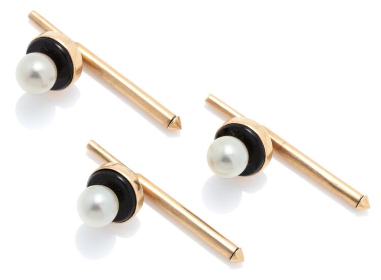 SET OF THREE GOLD GEMSET SHIRT STUDS; each applied with a 6mm round cultured pearl on an onyx ground in 12ct gold, wt. 6.7g.