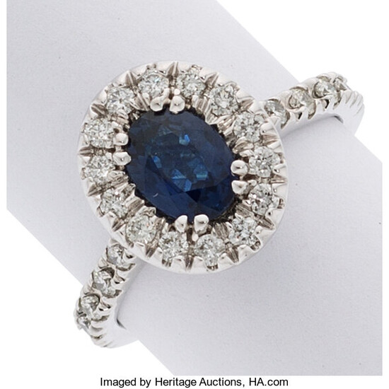 Sapphire, Diamond, White Gold Ring The ring features an...