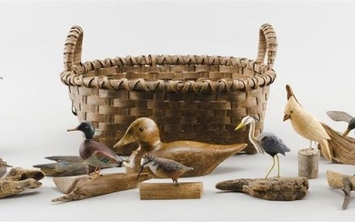 THIRTEEN MINIATURE AND LIFE-SIZE BIRD CARVINGS IN A SPLINTWORK HANDLED BASKET Birds by assorted makers. Includes a hummingbird by Gr...