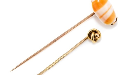 TWO ANTIQUE 15CT GOLD STICKPINS; one set with shell, in box, the other a knot design, total wt.4.46g.