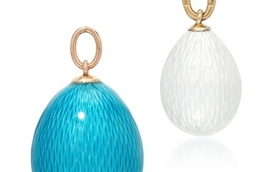 TWO GUILLOCHÉ ENAMELLED EGG PENDANTS, THE WHITE EGG BY FABERGÉ, WORKMASTER AUGUST HOLMSTRÖM, ST PETERSBURG, CIRCA 1890