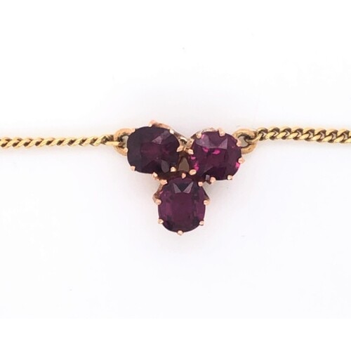 Three stone ruby pendant on 18k yellow gold chain, approxima...