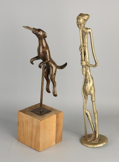 Two bronze figures. Consisting of one large African
