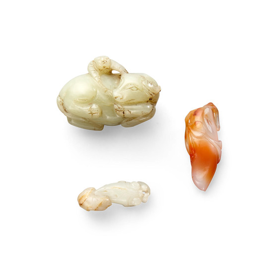 Two jade carvings and a carnelian toggle