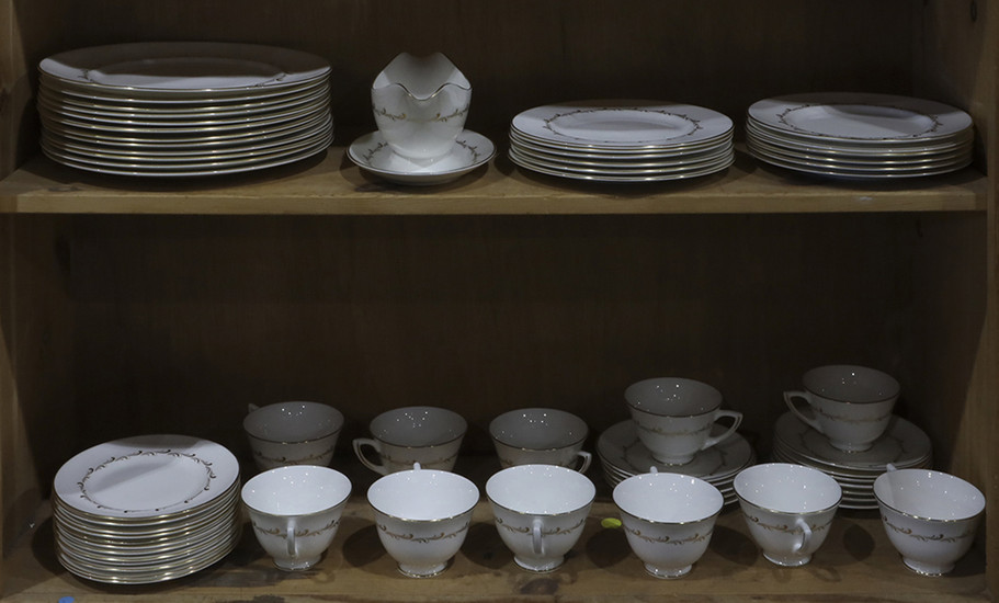 Two shelves with a partial Royal Doulton dinner service in the "Rondo" pattern, consisting of (12) dinner plates, 10