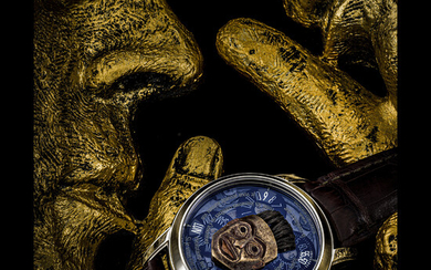 VACHERON CONSTANTIN. AN IMPRESSIVE AND EXTREMELY RARE 18K WHITE GOLD LIMITED EDITION AUTOMATIC WRISTWATCH WITH DAY, DATE AND 18K GOLD HAND ENGRAVED MICRO SCULPTURE OF AN ALASKAN TLINGIT INDIAN ANTIQUE MASK FROM THE BARBIER-MULLER MUSEUM METIERS D’ARTS...