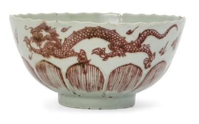A Chinese porcelain lotus-moulded celadon glazed 'dragon'...