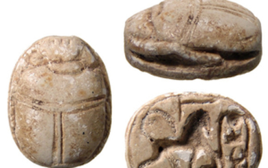 Egyptian scarab depicting a Sphinx trampling enemy