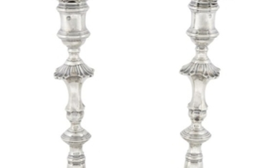 A pair of George II sterling silver candlesticks George...