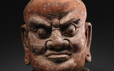 A rare carved wood head of a Lokapala