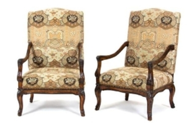 A Pair of Regence Style Carved Walnut Open Armchairs