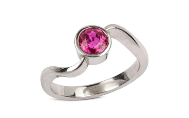A ruby single-stone ring The circular-cut ruby in...