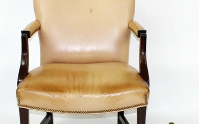 Tan leather upholstered armchair