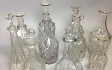 Ten Blown Colorless Glass Bottles