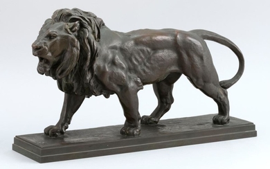 ANTOINE-LOUIS BARYE, France, 1795-1875, A lion., Bronze, height 9". Length 15.5". Width 4".