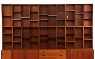 Peter Hvidt & Orla Mølgaard Nielsen: Wall unit of solid teak, consisting of three cabinets, chest of drawer and nine bookcases.