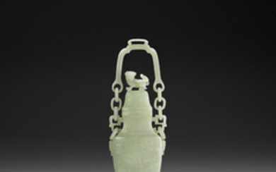 A pale green jade hanging vase and cover