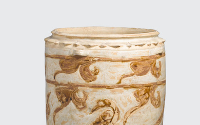 A cream glazed storage jar with brown inlay bird decoration