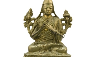 SINO-TIBETAN BRONZE FIGURE OF A LAMA Seated on a lotus stand. Height 4.25". Includes a brocade stand.