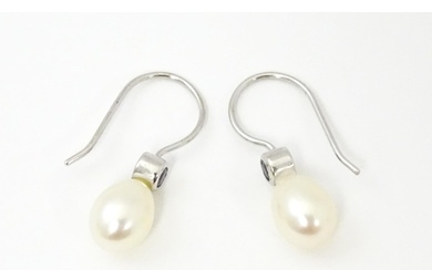 A 14ct white gold drop earrings set with pearls and pale blu...