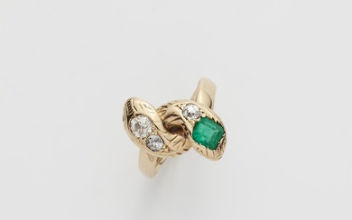 A 14k gold diamond and Columbian emerald snake ring.