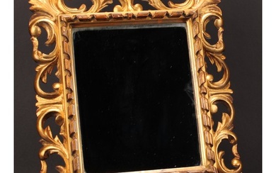 A 19th century giltwood looking looking glass, rectangular m...