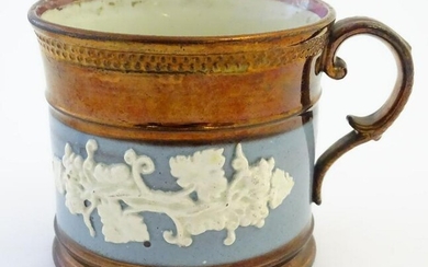 A 19thC copper lustre mug with banded vine decoration