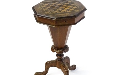 A 19thC trumpet shaped walnut sewing table with an octagonal...
