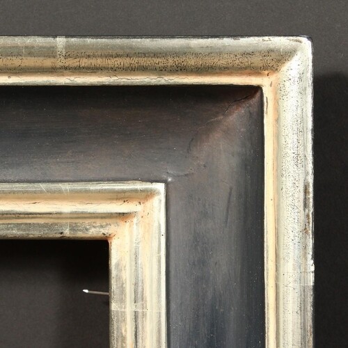 A 20th Century Continental ebonised and silvered frame, reba...