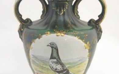 A 20thC baluster vase with a bulbous body, flared foot