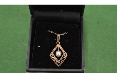 A 9ct yellow gold and pearl pendant and chain.