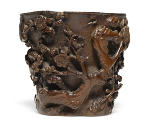A CARVED BAMBOO 'PRUNUS' LIBATION CUP QING DYNASTY, 17TH/18TH CENTURY