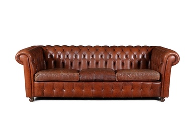 A CHESTERFIELD BUTTON BACK THREE SEATER SOFA, upholstered ...